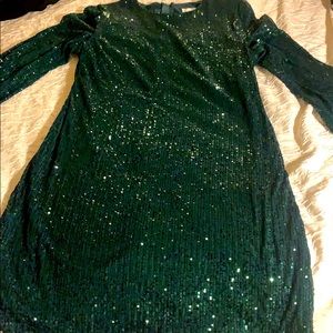 A green sequined dress, size 14.